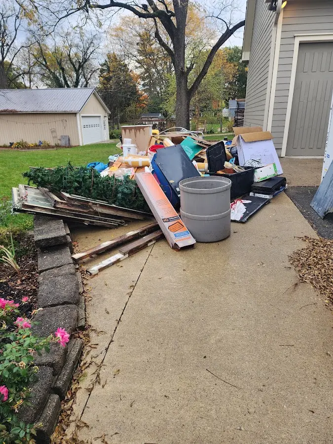Dumpster being loaded with debris for Demolition Dumpster Rental in Weisenberg